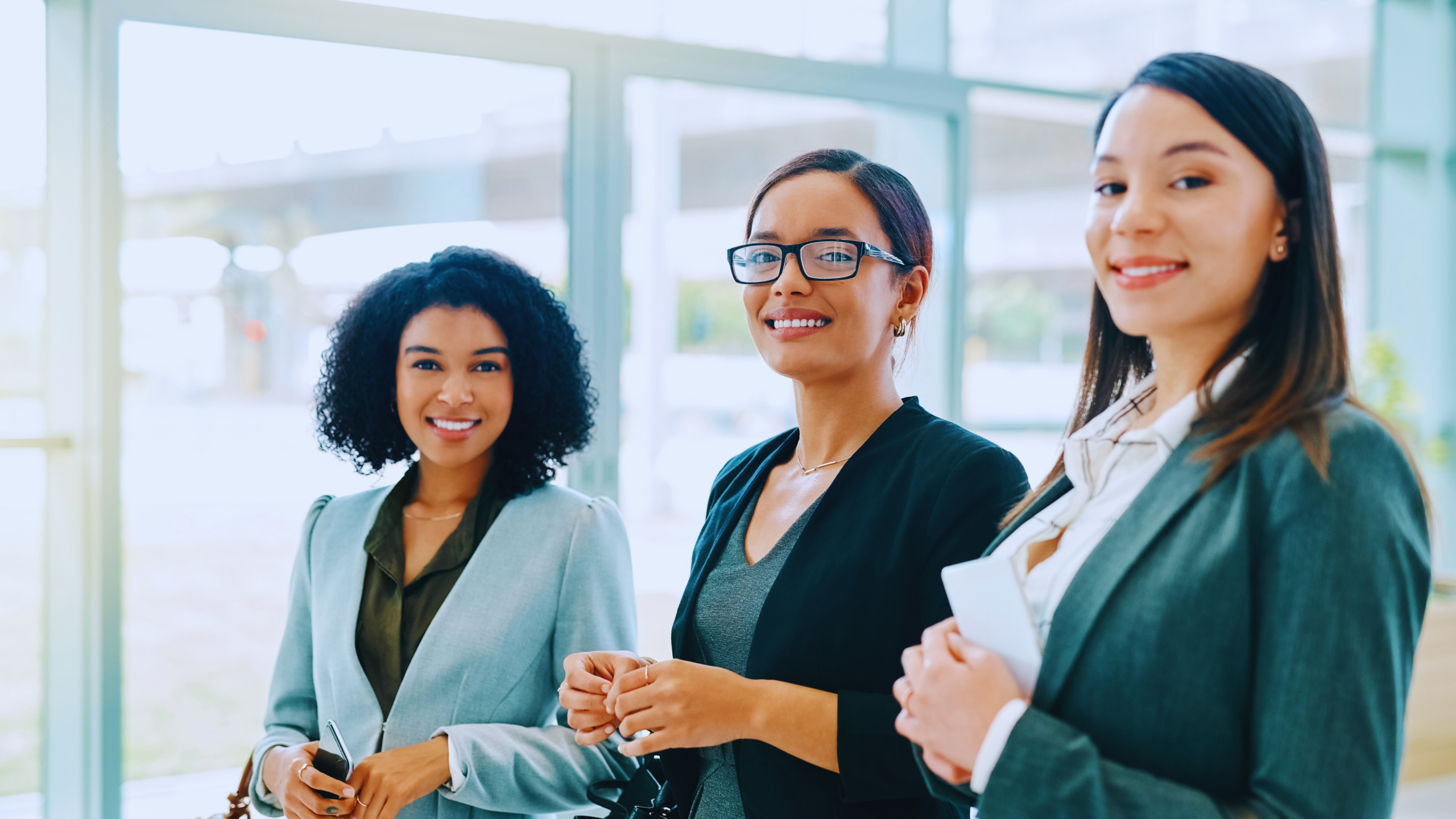 Logo for Our Community Three women working together