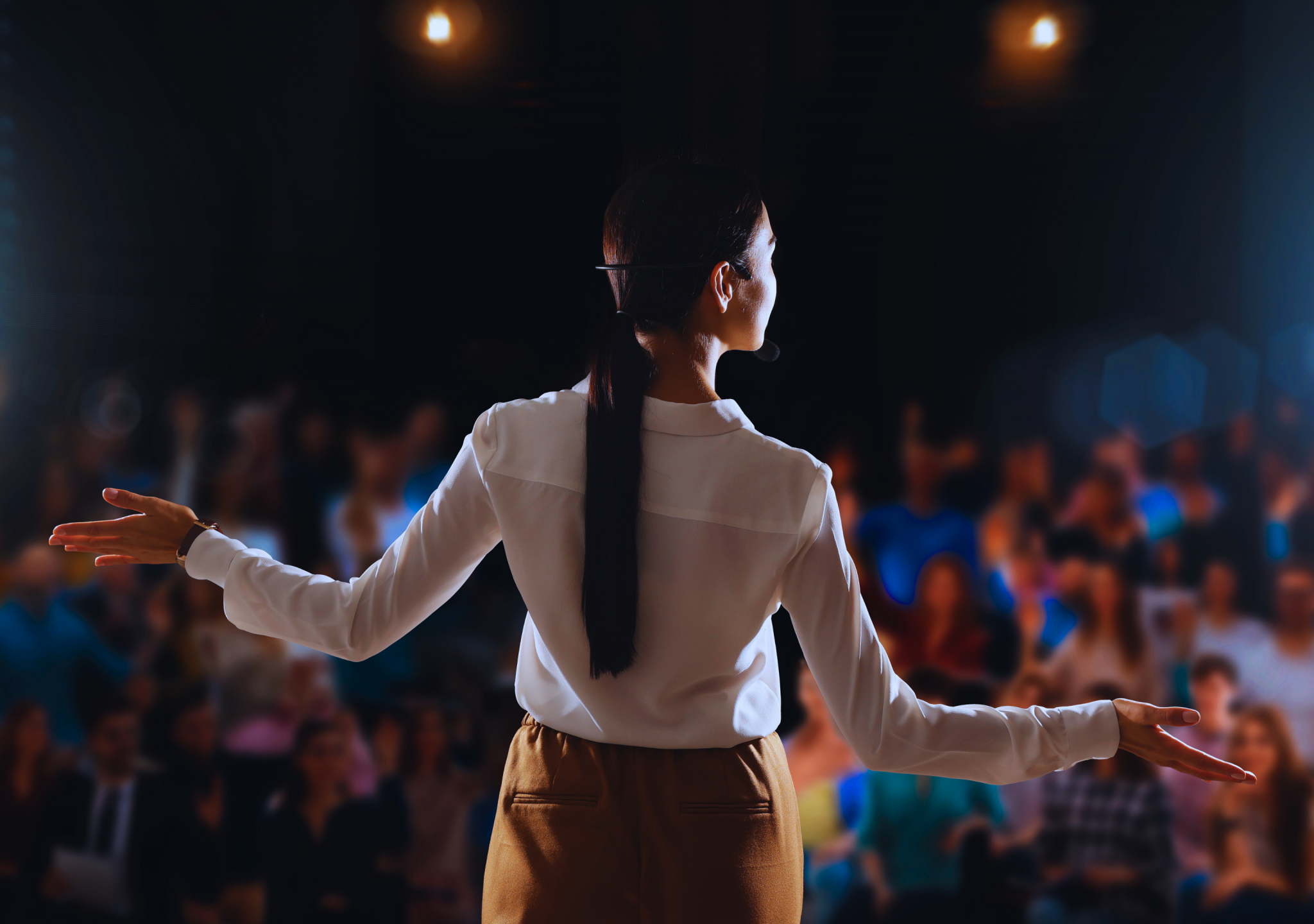 Woman speaking on stage