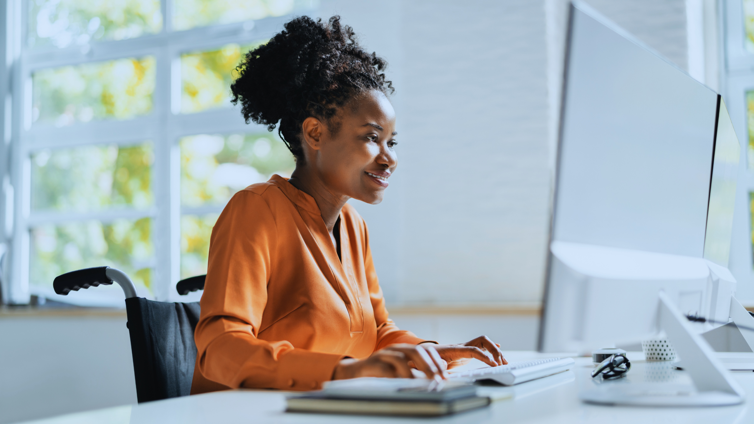 Woman sitting at a laptop